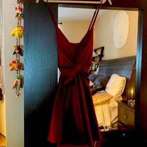 Beautiful burgundy wine colored backless dress with plunging neck line.